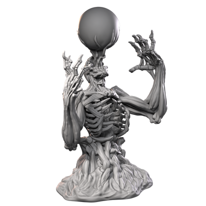 a statue of a skeleton holding a ball