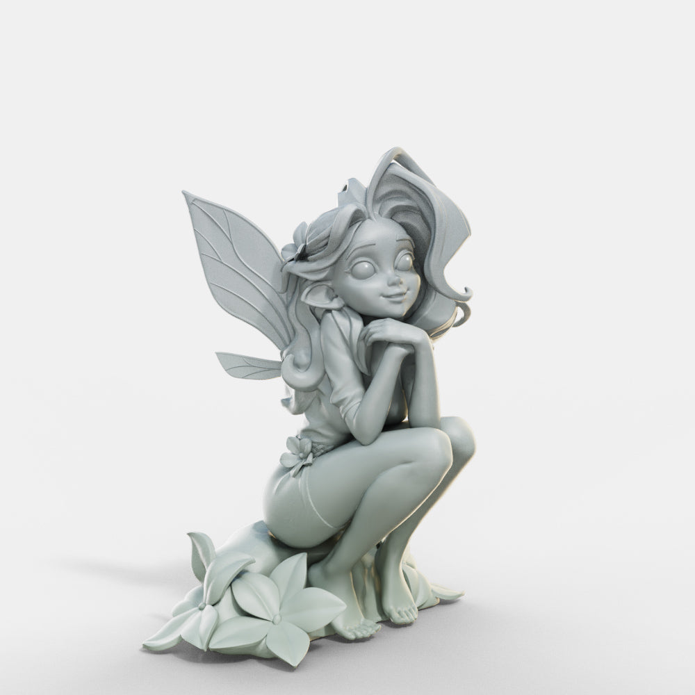 a statue of a fairy sitting on a flower