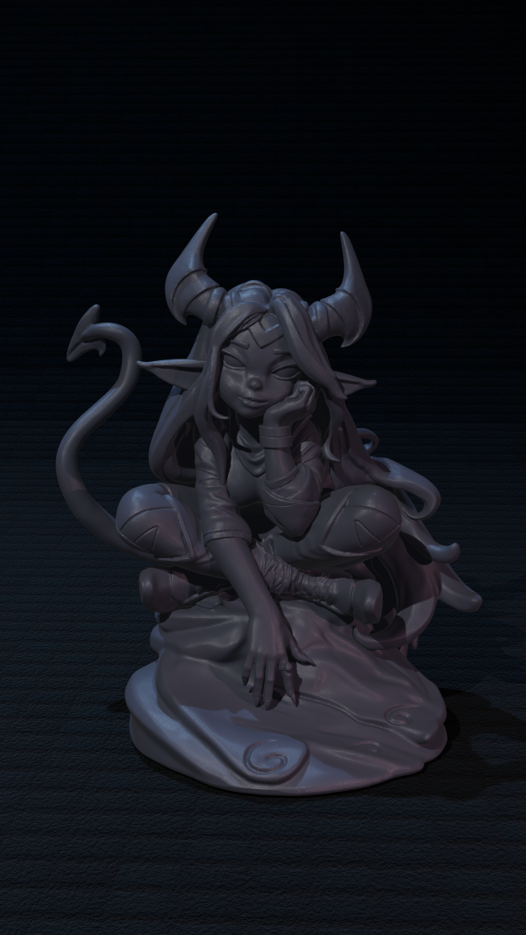 a statue of a demon sitting on a table