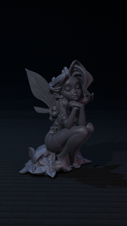 a statue of a fairy sitting on a pile of flowers