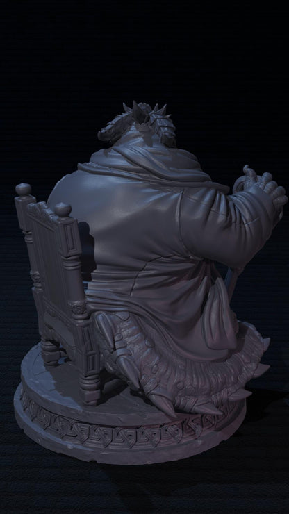 a statue of a man sitting in a chair